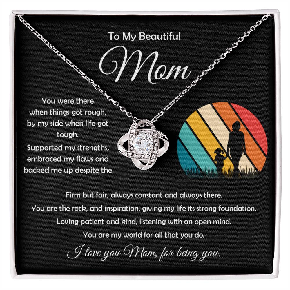 Elegant 14k white gold Love Knot Pendant with cubic zirconia stones