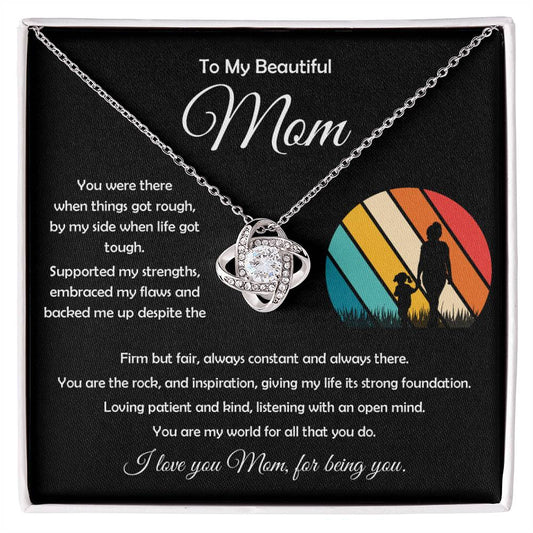 Elegant 14k white gold Love Knot Pendant with cubic zirconia stones