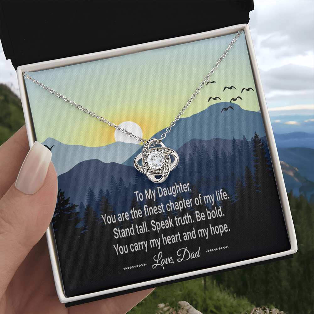 The complete Love Knot necklace and message card set, ready for gifting.
