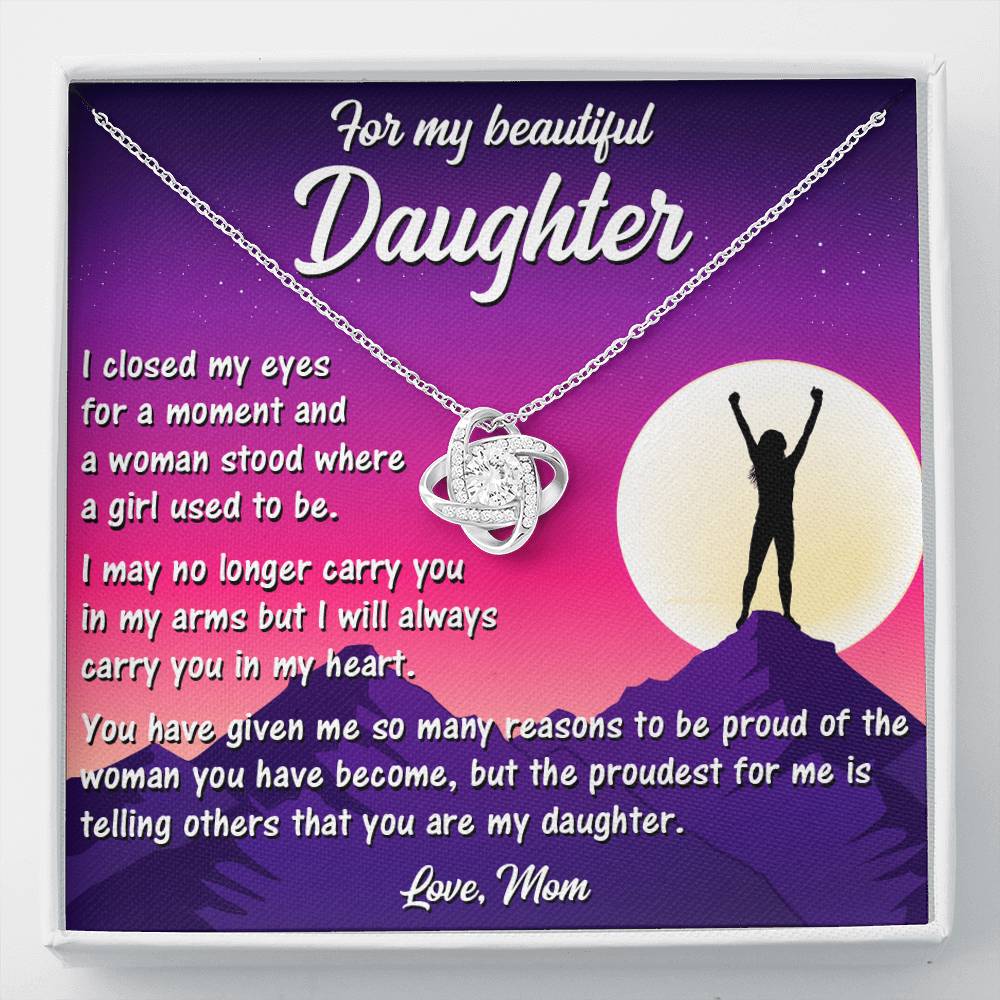 Delicate Love Knot Necklace from Mom to Daughter, highlighting its elegant white gold finish and cubic zirconia.