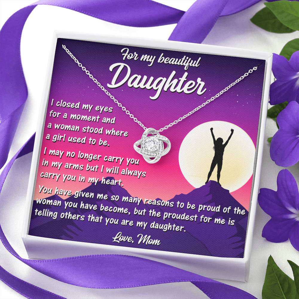 Delicate Love Knot Necklace from Mom to Daughter, highlighting its elegant white gold finish and cubic zirconia.