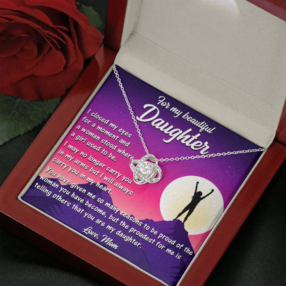 Delicate Love Knot Necklace from Mom to Daughter, highlighting its elegant white gold finish and cubic zirconia.