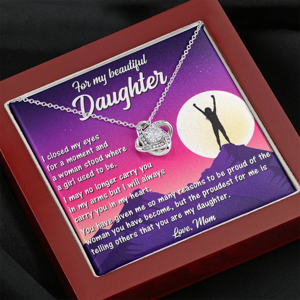 Delicate Love Knot Necklace from Mom to Daughter, highlighting its elegant white gold finish and cubic zirconia.