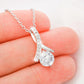 Close-up of daughter's love pendant from father with sparkling cubic zirconia