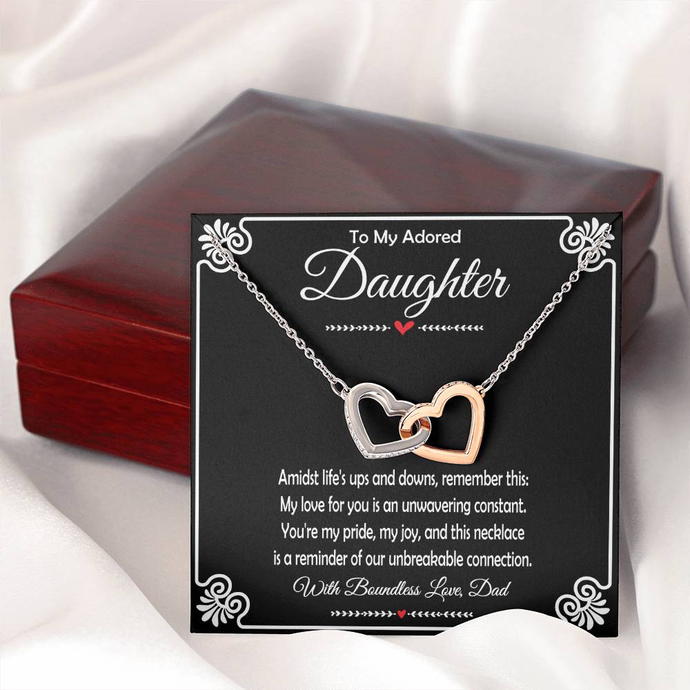 Close-up of interlocking hearts pendant symbolizing a father's love.