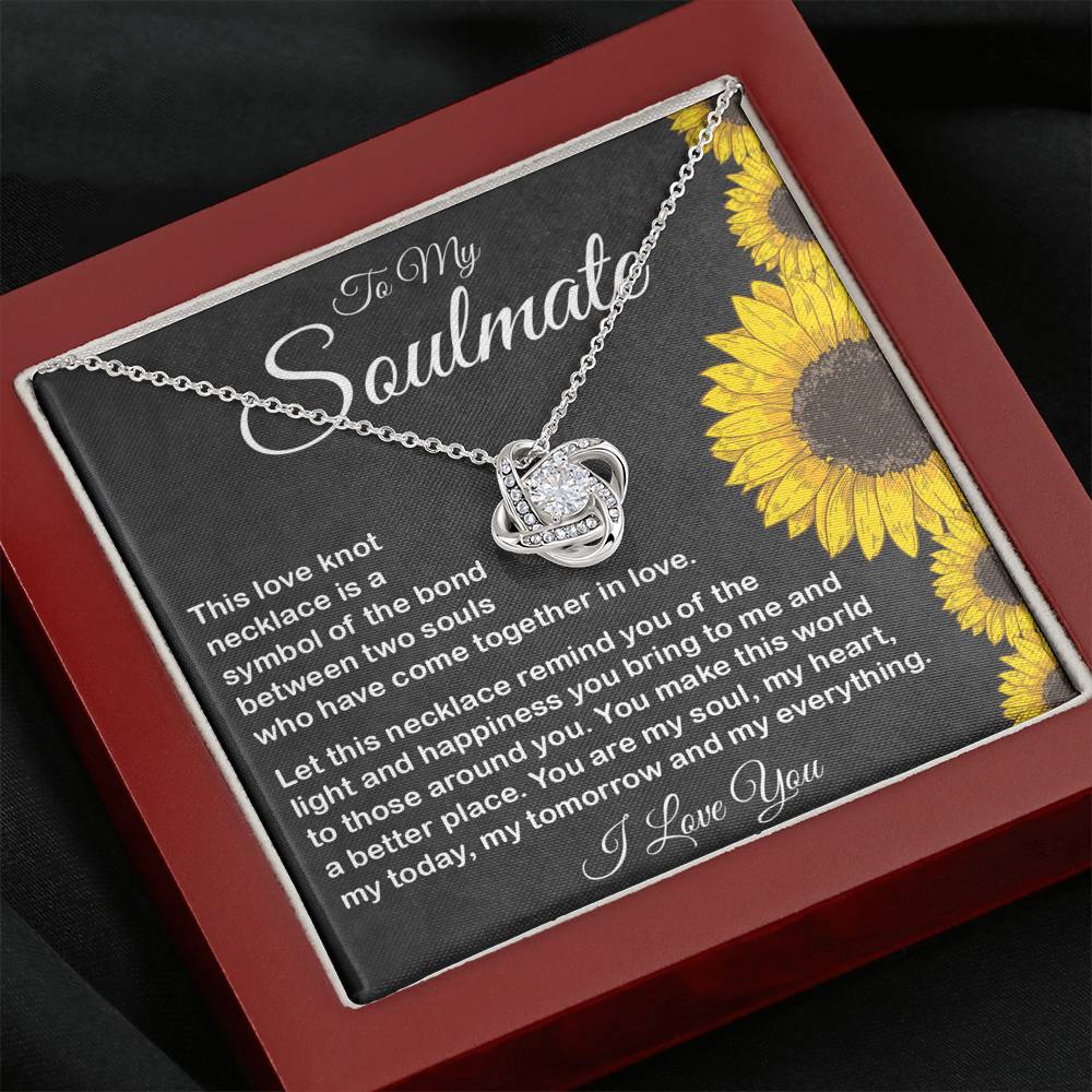 Close-up of delicate pendant design with loving message for her.